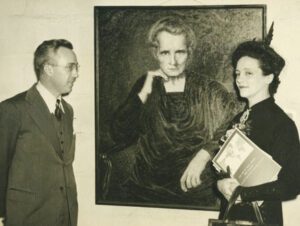 black and white photo of man, woman, and a painting